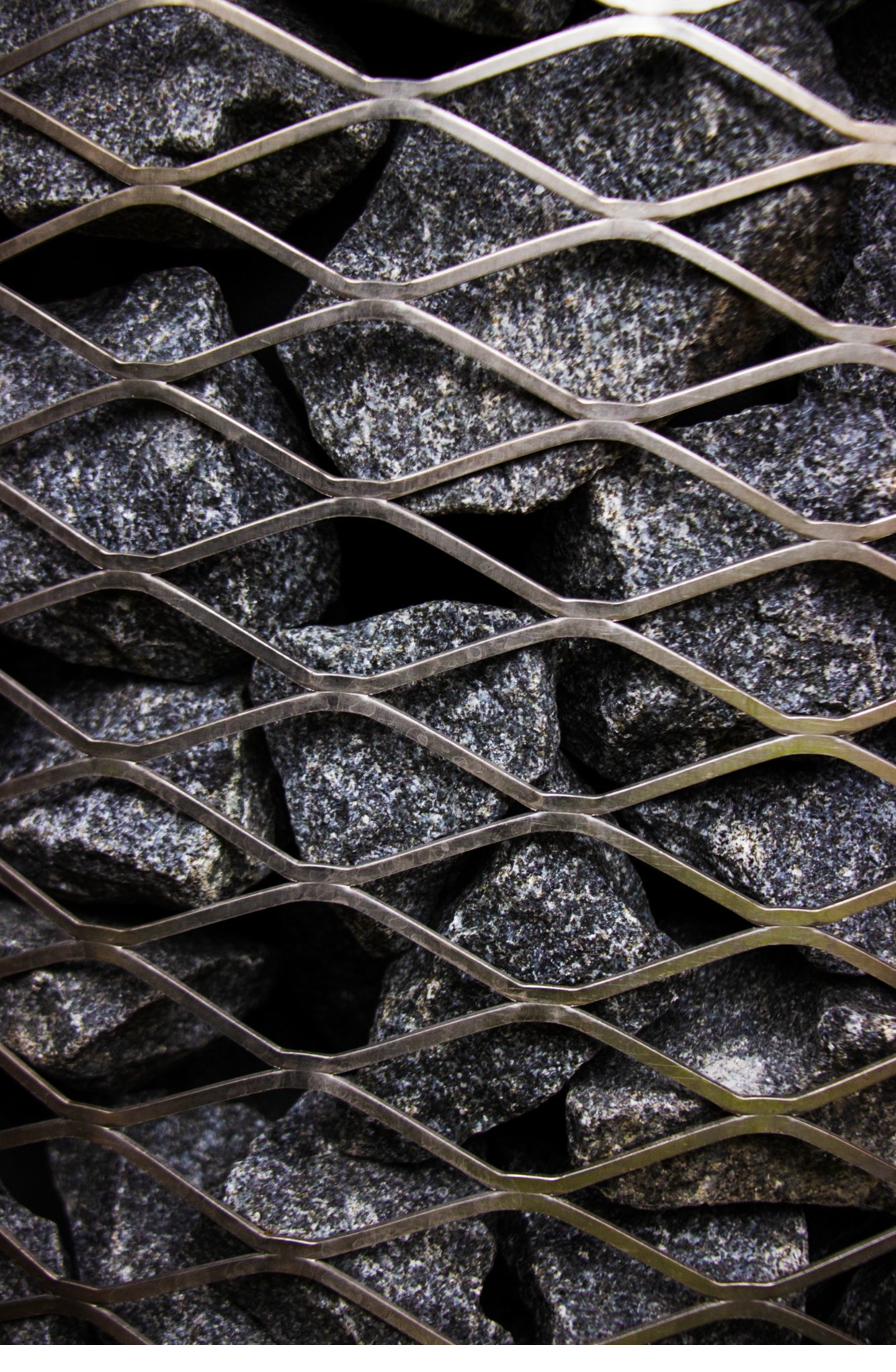 Texture close-up of Finnish granite sauna stones used in the iHKA sauna heater
