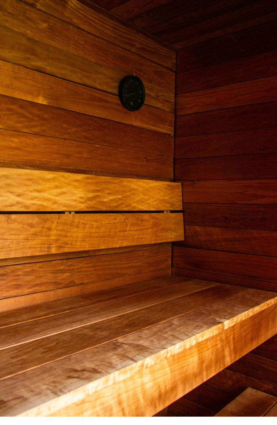 Two-tier ergonomic sauna bench crafted from Finnish wood inside the iHKA sauna